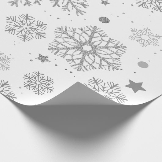 Silver snowflakes on white cadeaupapier (Hoek)