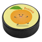 Sinaasappel citrusvruchten die met klauterdansen hockey puck (3/4)