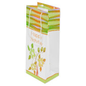 Sinaasappel en groene gebloemde cadeautas (Voorkant Gekanteld)