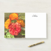 Sinaasappel en rode bloementuin post-it® notes (Op bureau)