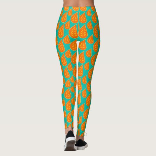 Sinaasappel en tel-groen abstract bladpatroon leggings (Achterkant)
