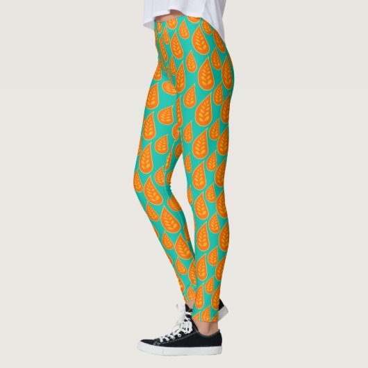 Sinaasappel en tel-groen abstract bladpatroon leggings (Links)