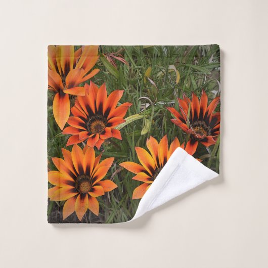 Sinaasappel en zwart Gazanias Gezicht Handdoek (Wasdoekje)