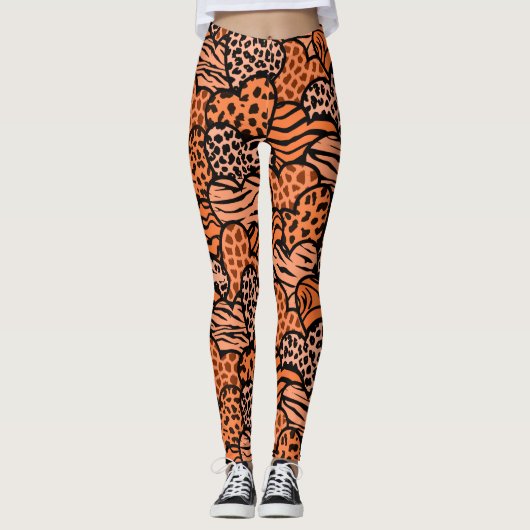 Sinaasappel en zwart meisjesprint harten polsje leggings (Voorkant)