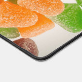 Sinaasappel groene rode snoep, gestrooid met suike bureaumat (Hoek)