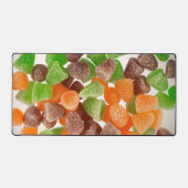 Sinaasappel groene rode snoep, gestrooid met suike bureaumat (Voorkant)