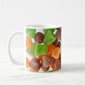 Sinaasappel groene rode snoep, gestrooid met suike koffiemok (Links)