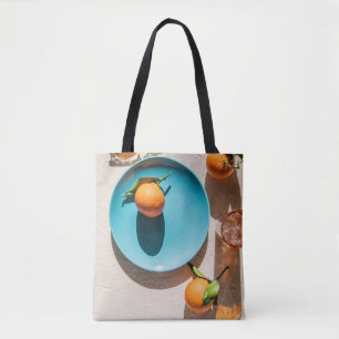 Sinaasappel op bord tote bag