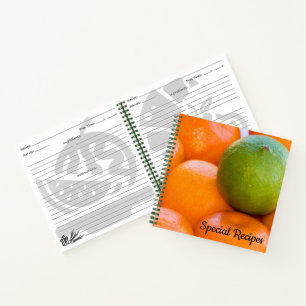 Sinaasappels en de Foto van het Close-up van het Notitieboek