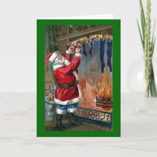 Sinterklaas bezig met het vullen van kousen feestdagen kaart (Voorkant)