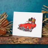Sinterklaas die een retro auto bestuurt met cadeau fotoplaat (Zijkant)