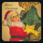 Sinterklaas Klimmen de Kerstboom -  Vierkante Sticker<br><div class="desc">Het kunstwerk toont de kerstman die een kerstboom beklimt met gouden klokken en een gouden strik aan de bovenkant. Het is een prachtige vintage afbeelding gepresenteerd op een gouden achtergrond. De kerstwens van "Vrolijk kerstfeest" is aanpasbaar - als u het wilt personaliseren! Voor speciale verzoeken of vragen kunt u contact...</div>