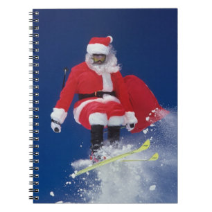 Sinterklaas op de skis die van een kraanhuis sprin notitieboek