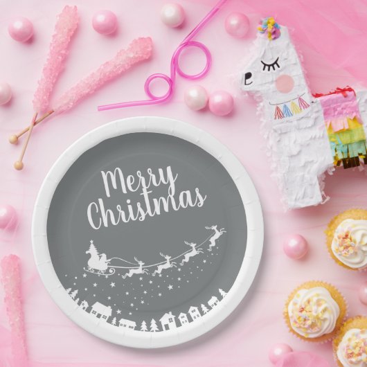 Sinters slee silhouette die boven de huizen vliegt papieren bordje (Feest)