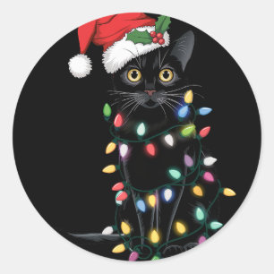 Sinterzwarte kat omhoog gedraaid in kerstboomverli ronde sticker