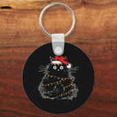 Sinterzwarte kat omhoog gedraaid in kerstboomverli sleutelhanger (Voorkant)