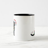 Sinterzwarte kat omhoog gedraaid in kerstboomverli tweekleurige koffiemok (Center)