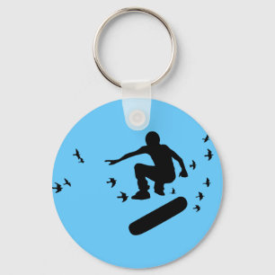skateboard met sleutelhanger van vogels