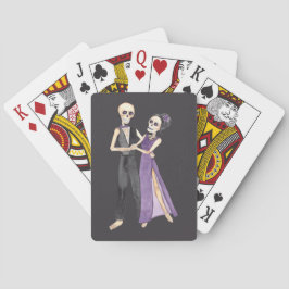 Skeletkoppel dansend op een set van pokerkaarten