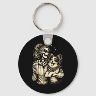 Skeletmeisje knuffelt Papillon-hond Schattige koff Sleutelhanger