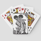 Skeletverdichtingskoppel op een set pokerkaarten (Achterkant)