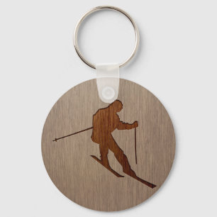Skiende silhouet gegraveerd op houten ontwerpen sleutelhanger