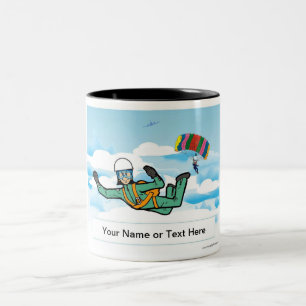 Skydiving - Vrouw Cartoon door PrintedPerfection Tweekleurige Koffiemok