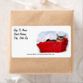 Slaapkeuten in een heldere rode mand etiket (Insitu)