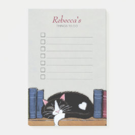 Slaaptuxedo-kat op boekenplank post-it® notes