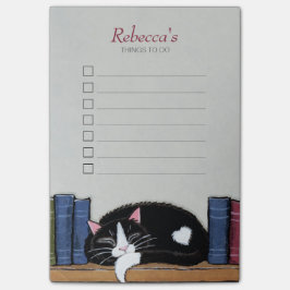 Slaaptuxedo-kat op boekenplank post-it® notes