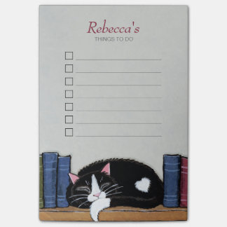 Slaaptuxedo-kat op boekenplank post-it® notes
