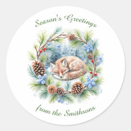 Slaapvos in de winter krans vakantie ronde sticker