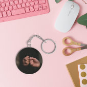 Sleutelhanger handen aanraken