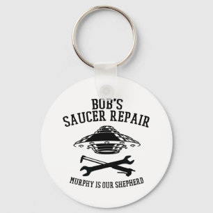 sleutelhanger met zwart Bob's Saucer Repair-logo