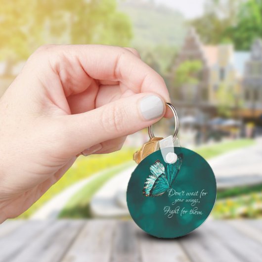 Sleutelhanger van Turquoise en zwarte vlinder