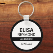 sleutelhouder met naam en datum op zwart-wit sleutelhanger (Voorkant)