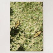 Slib-vlinders op bloeiende struikgewas legpuzzel (Verticaal)