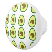 Slicte groene avocado op wit keramische knop (Rechts)