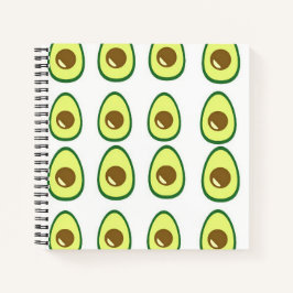 Slicte groene avocado op wit notitieboek