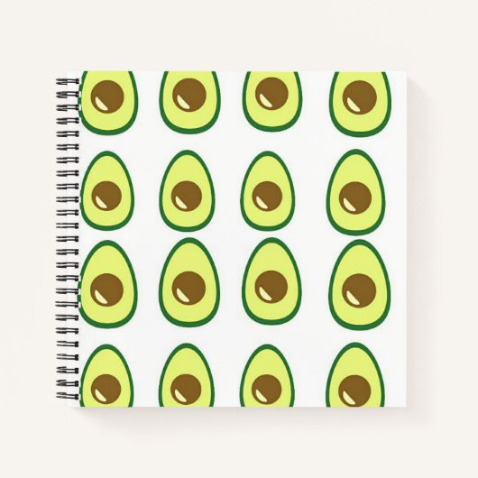Slicte groene avocado op wit notitieboek (Voorkant)