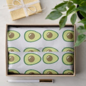 Slicte groene avocado op wit tissuepapier (Geschenk)