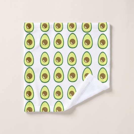 Slicte groene avocado op wit washandje (Wasdoekje)