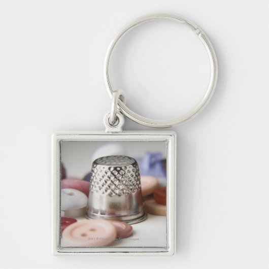Sluiten van knopen met een pet van metaal sleutelhanger (Voorkant)