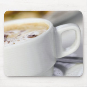 Sluiting van een kop koffie muismat
