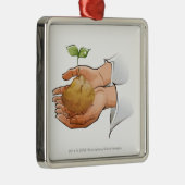 Sluiting van iemands handen die zaailingen vasthou metalen ornament (Rechts)