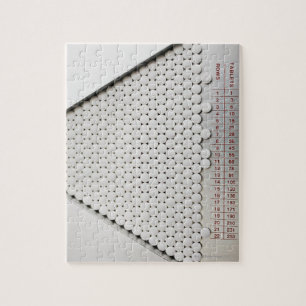 Sluiting van pillen in sorteerlade legpuzzel