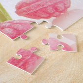 Smaak van frambozenachtige snoepjes in groene beke legpuzzel (Zijkant)