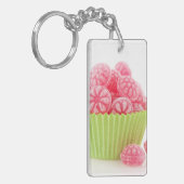 Smaak van frambozenachtige snoepjes in groene beke sleutelhanger (Voorkant Links)