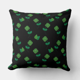 Smaragdbloesems op zwart kussen
