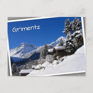 Sneeuw bedekte blokhutten in Zwitserland Briefkaart
